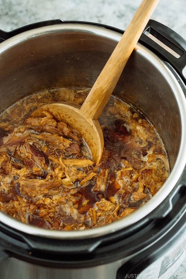 Flavorful and fall-apart tender Asian Pulled Pork in the Instant Pot.