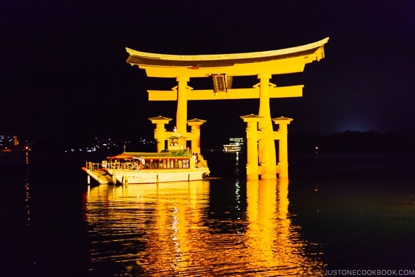 boat going through Torii gate Itsukushima | JustOneCookbook.com