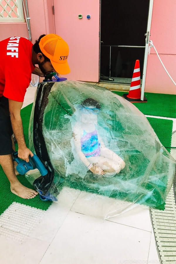 inflatable water walking ball being filled with air Suginoi Hotel Beppu - Beppu travel guide | justonecookbook.com