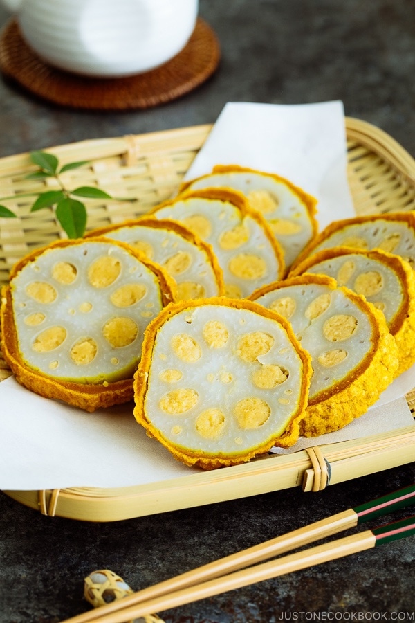 Karashi Renkon - deep fried lotus root stuffed with Japanese hot mustard miso on a bamboo basket.