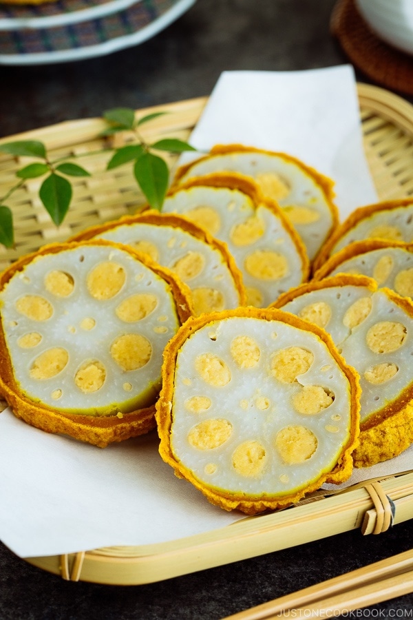 Karashi Renkon - deep fried lotus root stuffed with Japanese hot mustard miso on a bamboo basket.