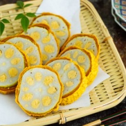 Karashi Renkon - deep fried lotus root stuffed with Japanese hot mustard miso on a bamboo basket.