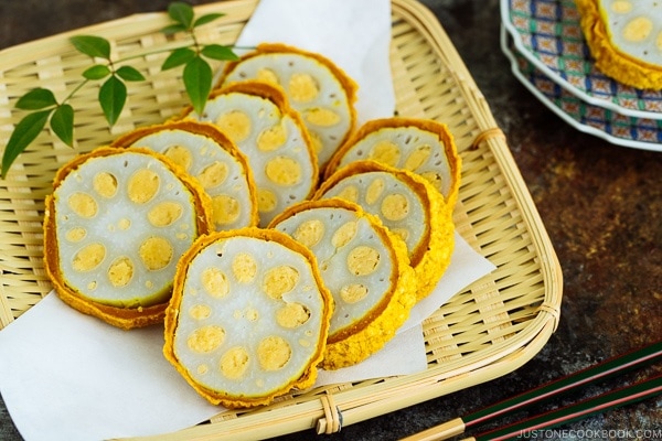 Karashi Renkon - deep fried lotus root stuffed with Japanese hot mustard miso on a bamboo basket.