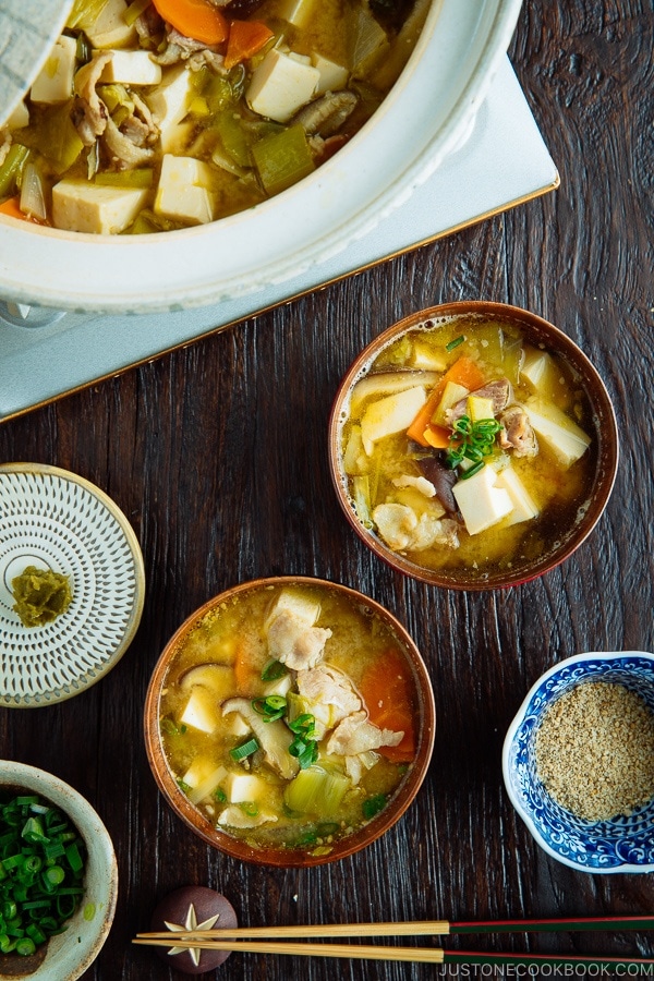 Pork belly and vegetable miso soup served in the Japanese wooden bowl.