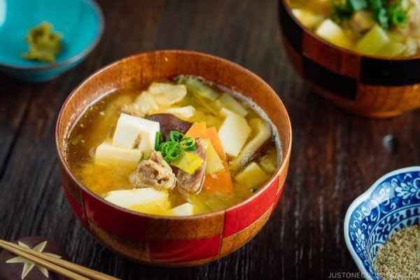 Pork belly and vegetable miso soup served in the Japanese wooden bowl.