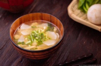 Japanese turnip miso soup in a wooden bowl.