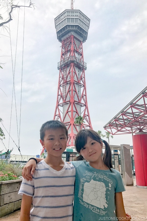 children in front of Hakata Port Tower - Fukuoka Travel Guide | justonecookbook.com