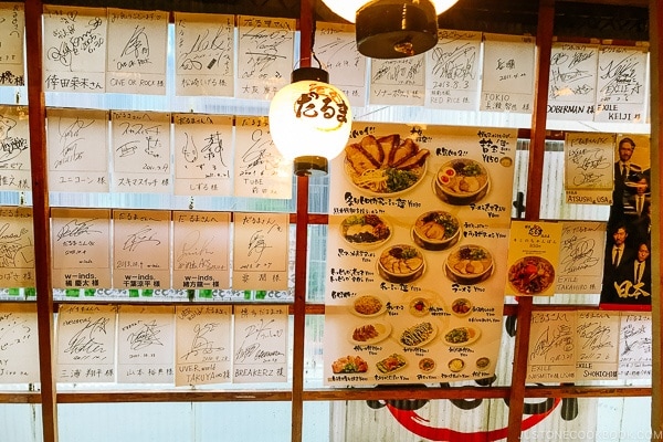 interior wall with signed autographs at Hakata Daruma Ramen - Fukuoka Travel Guide | justonecookbook.com