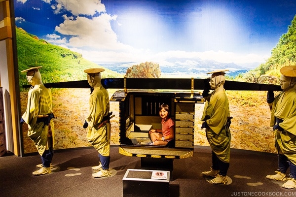 child inside carriage at Wakuwakuza History and Cultural Experience - Kumamoto Travel Guide | justonecookbook.com