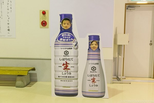 children behind soy sauce bottle cut out at Kikkoman Factory in Noda Japan | Kikkoman Factory Tour - justonecookbook.com