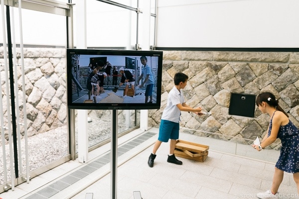 children acting in augmented reality scene at Imperial soy sauce brewery at Kikkoman Factory in Noda Japan | justonecookbook.com