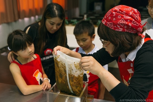 Kikkoman staff explaining how sauce soy is pressed at Kikkoman Factory in Noda Japan | justonecookbook.com