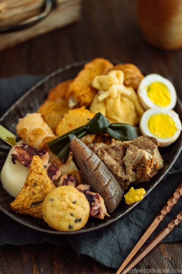 Oxtail Oden (Japanese Fish Cake Stew) served in a dark plate.