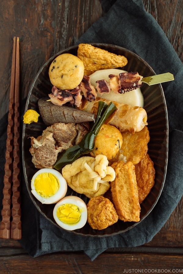 Oxtail Oden (Japanese Fish Cake Stew) served in a dark plate.