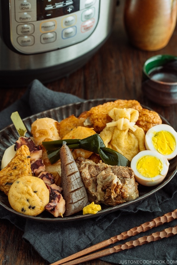 Oxtail Oden (Japanese Fish Cake Stew) served in a dark plate.