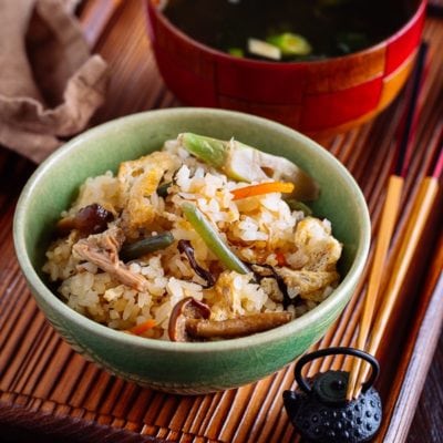 Rice with Mountain Vegetables (Sansai Gohan) served in a green ceramic bowl.