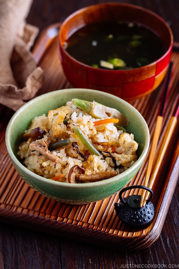 Rice with Mountain Vegetables (Sansai Gohan) served in a green ceramic bowl.