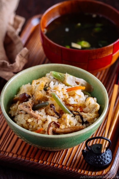 Rice with Mountain Vegetables (Sansai Gohan) served in a green ceramic bowl.