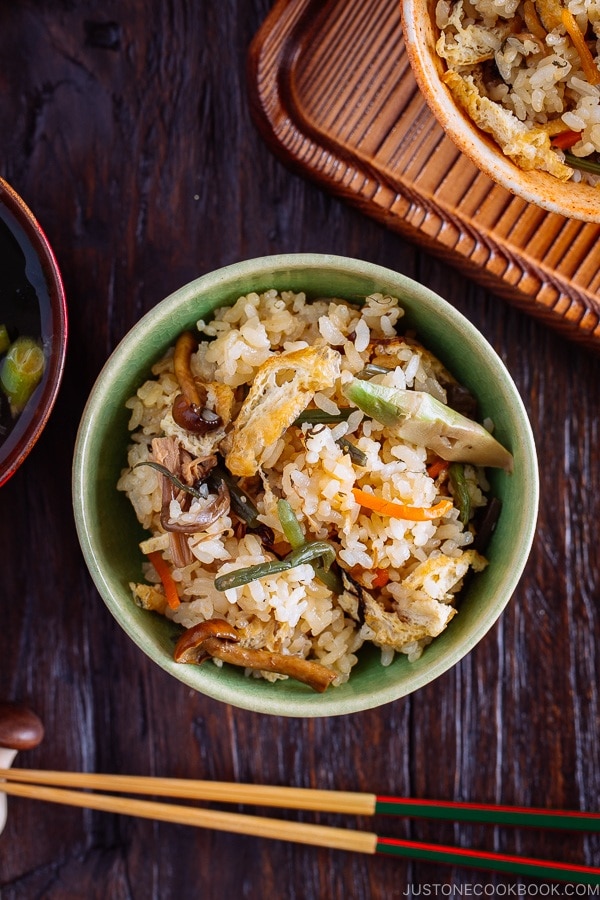 Rice with Mountain Vegetables (Sansai Gohan) served in a green ceramic bowl.