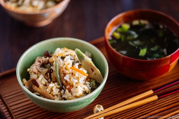 Rice with Mountain Vegetables (Sansai Gohan) served in a green ceramic bowl.