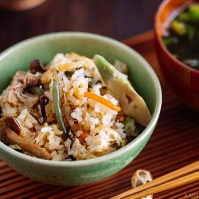 Rice with Mountain Vegetables (Sansai Gohan) served in a green ceramic bowl.