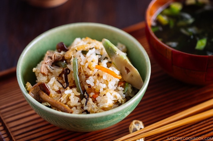 Rice with Mountain Vegetables (Sansai Gohan) served in a green ceramic bowl.