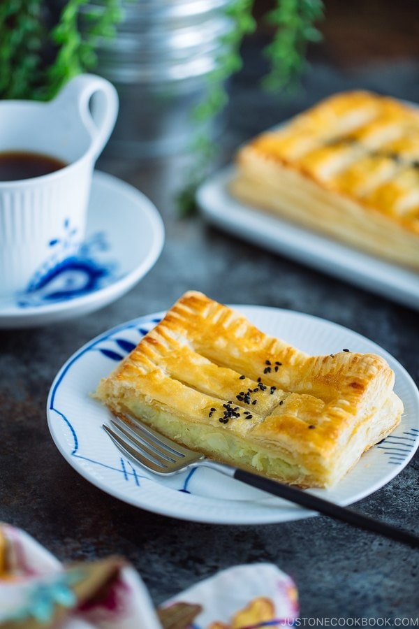 Japanese sweet potato pie/puff pastry is on a white plate.