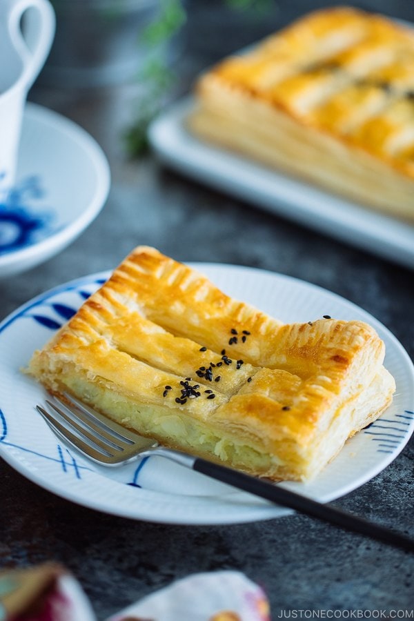 Japanese sweet potato pie/puff pastry is on a white plate.