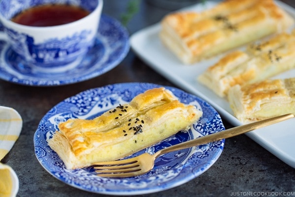 Japanese sweet potato pie/puff pastry is on a white plate.