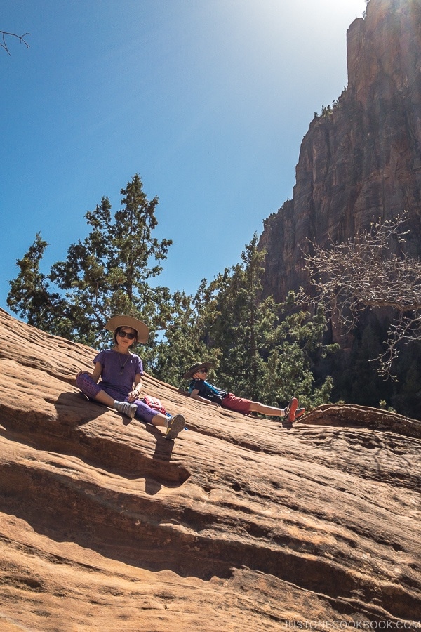 children climbing on rock near Lower Emerald Pool - Zion National Park Travel Guide | justonecookbook.com
