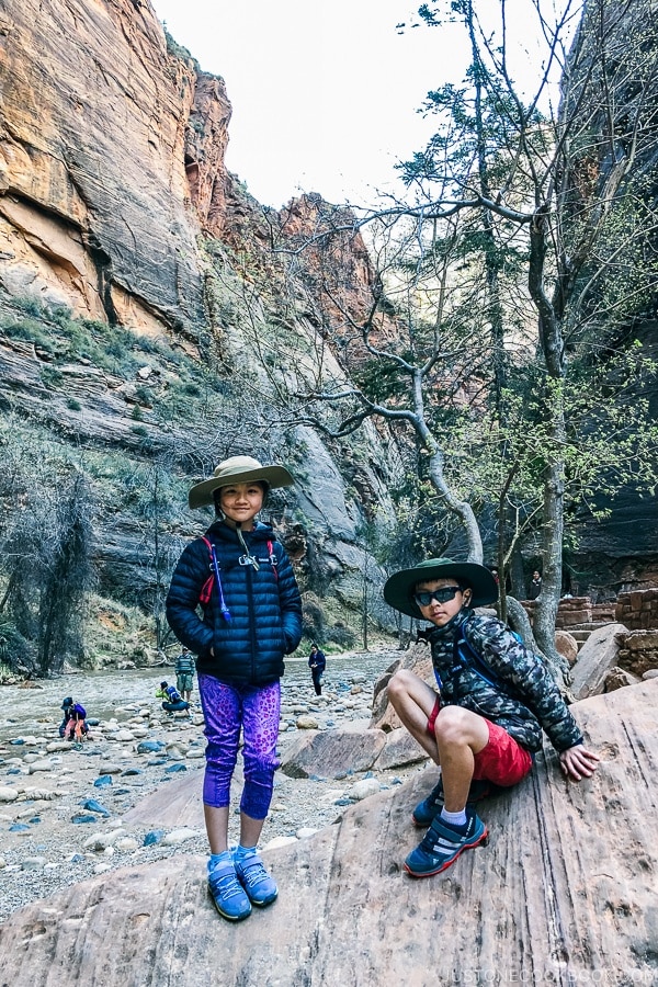 children on rock at the end of Riverside Walk - Zion National Park Travel Guide | justonecookbook.com