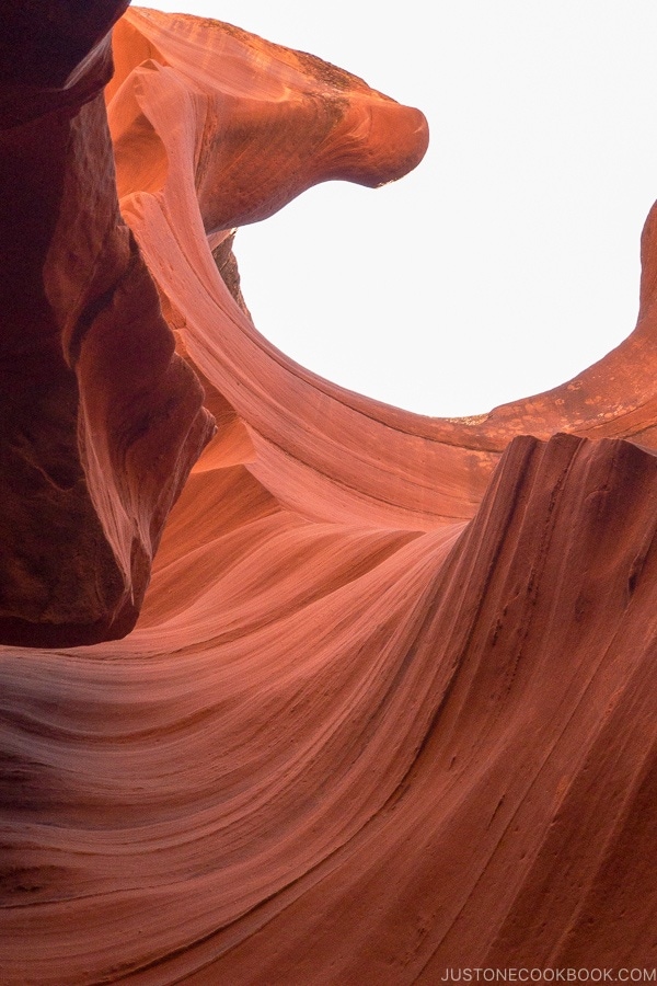 sand rock formation looking up into the sky - Lower Antelope Canyon Photo Tour | justonecookbook.com