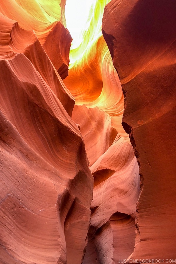 sand rock formation looking up into the sky - Lower Antelope Canyon Photo Tour | justonecookbook.com