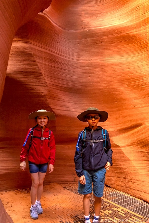 children standing in front of sand rock wall - Lower Antelope Canyon Photo Tour | justonecookbook.com