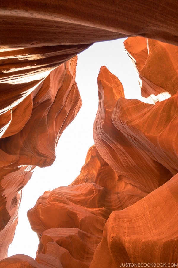 sand rock formation looking up into the sky - Lower Antelope Canyon Photo Tour | justonecookbook.com