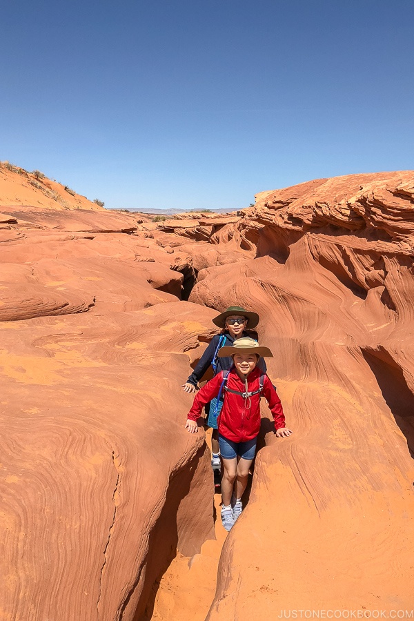 children at crack near end of trail - Lower Antelope Canyon Photo Tour | justonecookbook.com