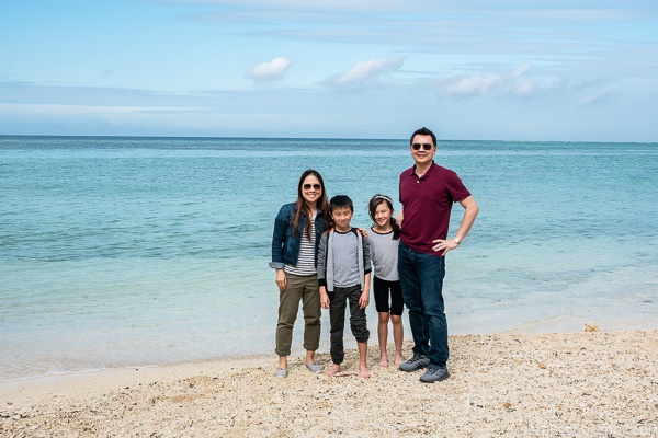 Just One Cookbook family next to clear ocean and sandy beach at Ocean Expo Park Okinawa | justonecookbook.com