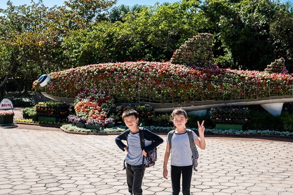 children in front of plants shaped like a whale shark at Ocean Expo Park Okinawa | justonecookbook.com