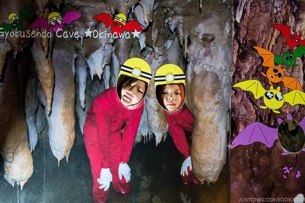 children behind Gyokusendo Cave cutout - Okinawa World | justonecookbook.com