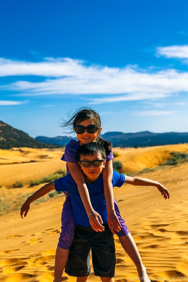 children standing in sand dune - Coral Pink Sand Dunes State Park | justonecookbook.com