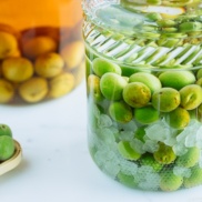 Japanese plum wine (umeshu) in a glass jar.