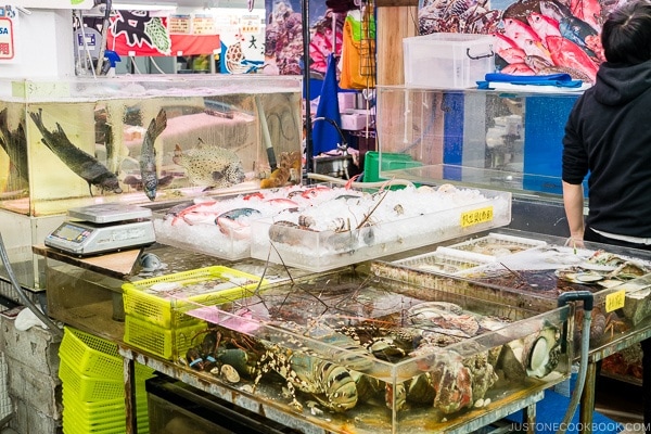 vendor selling fresh seafood at First Makishi Public Market - Okinawa Travel Guide | justonecookbook.com