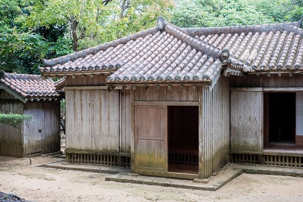 wooden building with tile roof at Shikinaen - Okinawa Travel Guide | justonecookbook.com