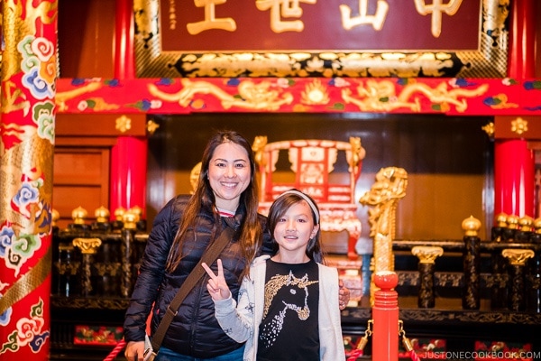 Nami and child at Shuri Castle in front of the royal court - Okinawa Travel Guide | justonecookbook.com