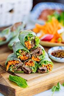Fresh spring rolls with Yakiniku (Japanese BBQ) and julienned vegetables and fresh herbs along with homemade Yakiniku Sauce.