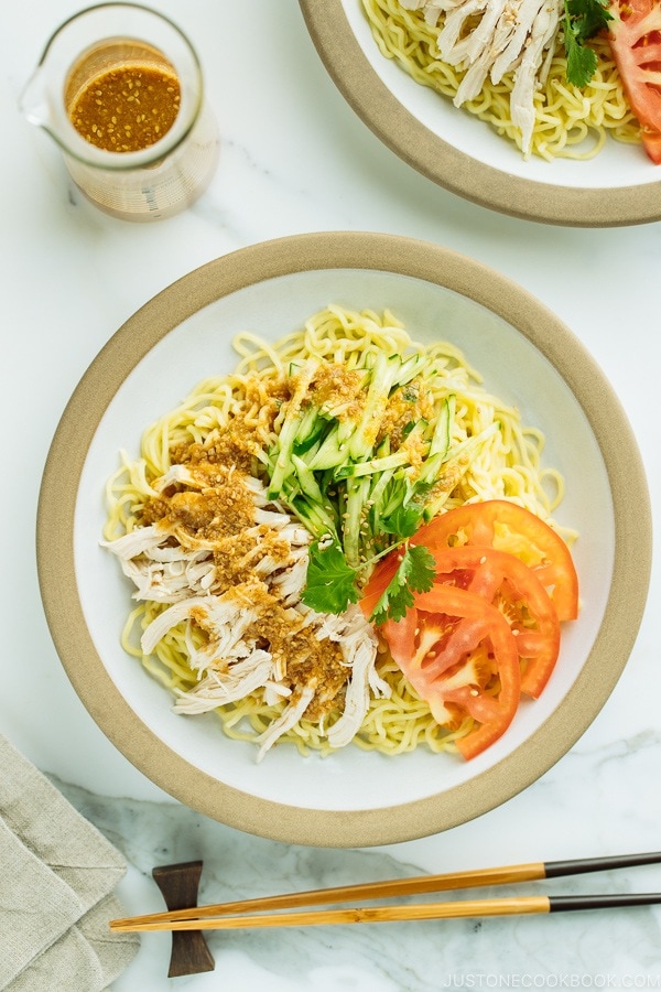 Cold Ramen - Hiyashi Chuka with Sesame Miso Sauce served with cucumbers, tomato, shredded blanched chicken.