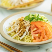 Cold Ramen - Hiyashi Chuka with Sesame Miso Sauce served with cucumbers, tomato, shredded blanched chicken.
