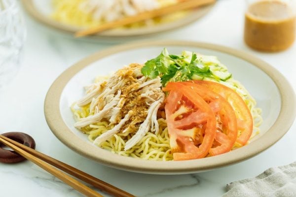 Cold Ramen - Hiyashi Chuka with Sesame Miso Sauce served with cucumbers, tomato, shredded blanched chicken.