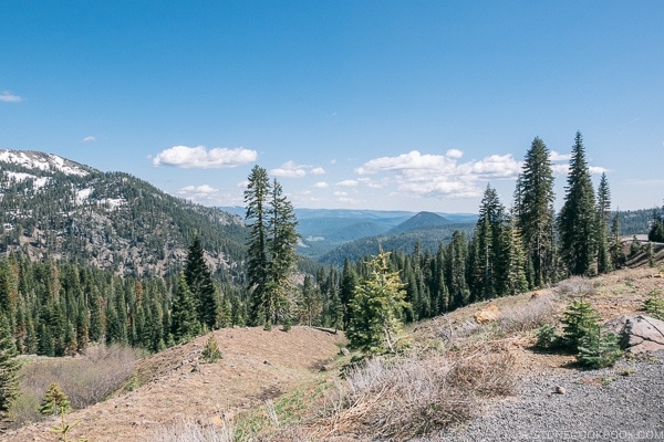 view of trees and nearby mountains - Lassen Volcanic National Park Travel Guide | justonecookbook.com