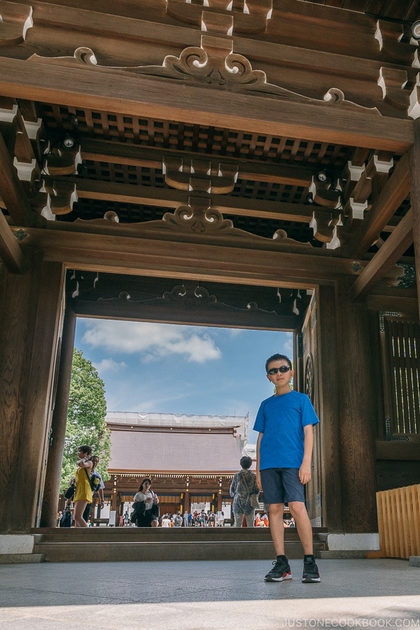 child standing at Meiji Jingu Minami Gate - Meiji Jingu Guide | justonecookbook.com
